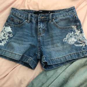 Floral embroidered jean shorts